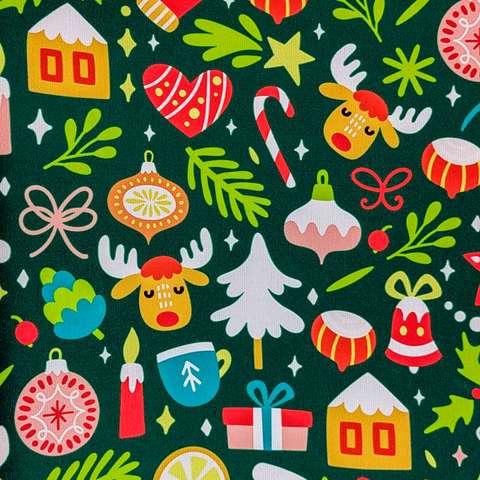 Close up of polyester silk fabric with a Christmas theme featuring reindeer, candy sticks, bells, ice capped trees, candles, gift wrapped gifts and mistletoe on a deep green background.