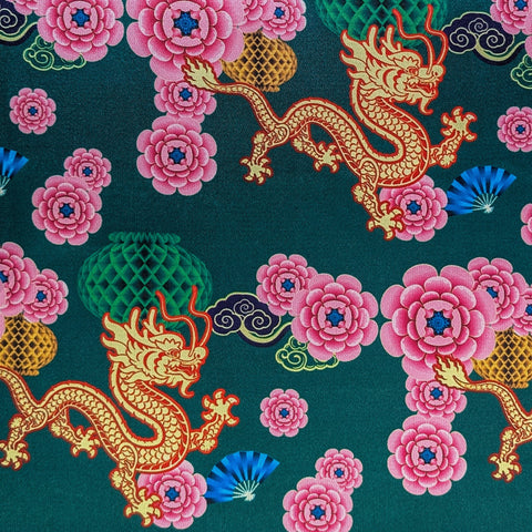 Fabric pattern with dragons and pink flowers on a green background