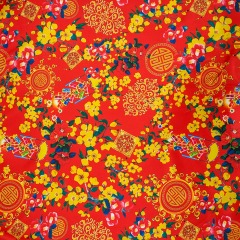 Red polyester silk fabric with print of yellow flowers and firecrackers.