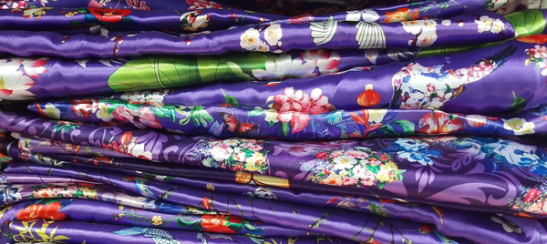 A pile of purple themed fabrics.