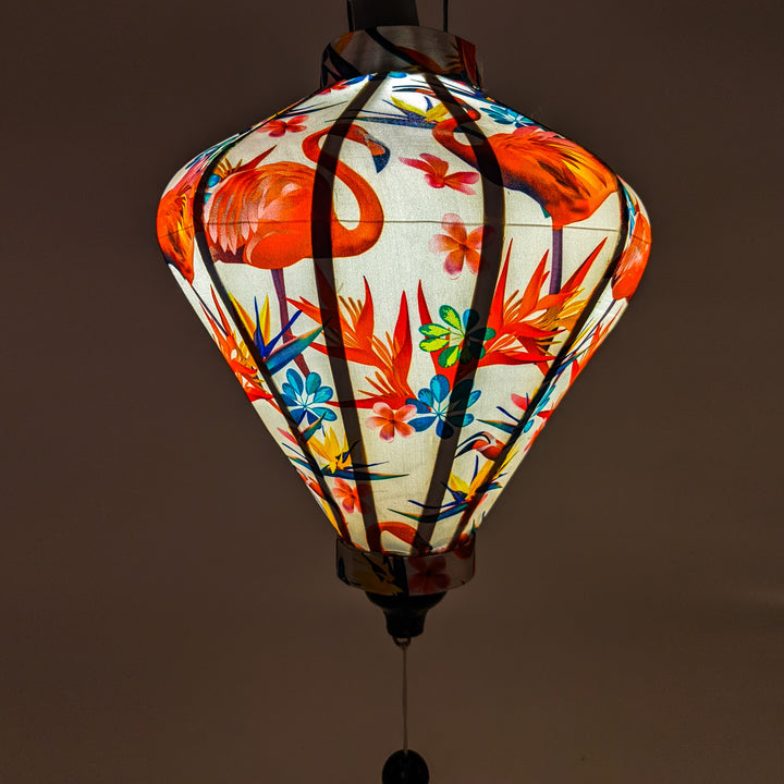 Soft cozy glow created from this Diamond shaped Vietnamese lantern with flamingos and bird of paradise flowers.