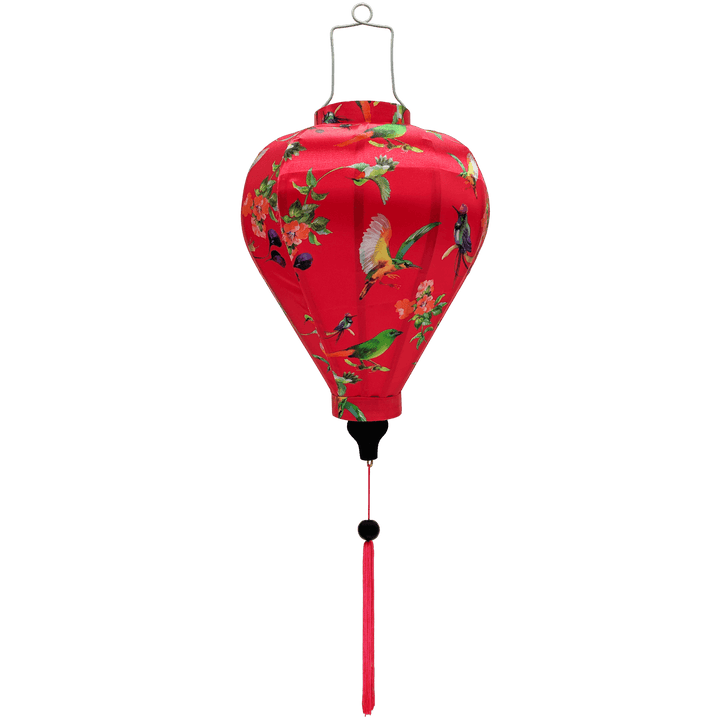 Balloon shaped lantern with pink tassel featuring a print of various birds in flight with peach flowers against a hot pink.