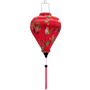 Balloon shaped lantern with pink tassel featuring a print of various birds in flight with peach flowers against a hot pink.