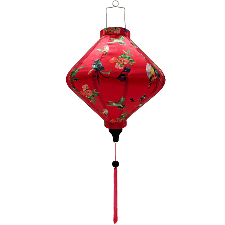 Lozenge shaped lantern with pink tassel featuring a print of various birds in flight with peach flowers against a hot pink.