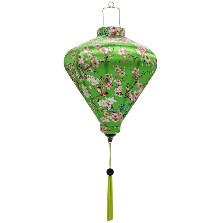 Diamond shaped Vietnamese lantern with green tassel and print of red-headed woodpecker birds sitting in cherry blossom trees on a bright green background.