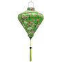 Diamond shaped Vietnamese lantern with green tassel and print of red-headed woodpecker birds sitting in cherry blossom trees on a bright green background.