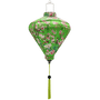Diamond shaped Vietnamese lantern with green tassel and print of red-headed woodpecker birds sitting in cherry blossom trees on a bright green background.