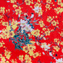 Polyester silk fabric with yellow and white flowers on a red background