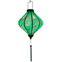 Glowing Lozenge shape lantern with birds on green background.