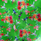 Close up of polyester silk fabric with a print of bright bunches of flowers and various feathery avian species on a bright green backdrop.