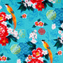 Polyester silk fabric used to create lanterns featuring large orange birds, vibrant red and pink flowers, intricate gold emblems against a electric blue.