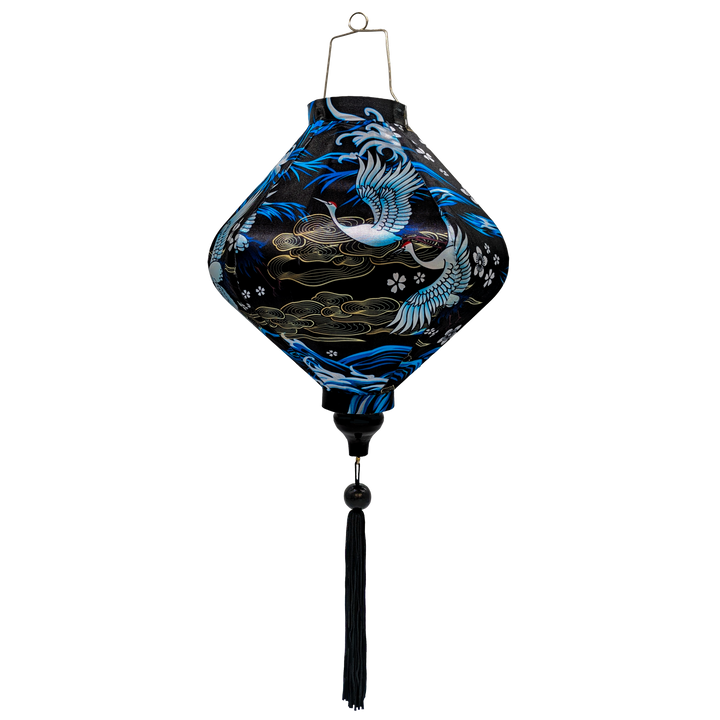 Lozenge shaped lantern featuring a print of birds in graceful flight, set against a sleek black background adorned with rolling waves, floating flowers and intricate gold illustrations.