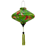 UFO shaped lantern with green tassel featuring a print of bright bunches of flowers and various feathery avian species on a bright green backdrop.