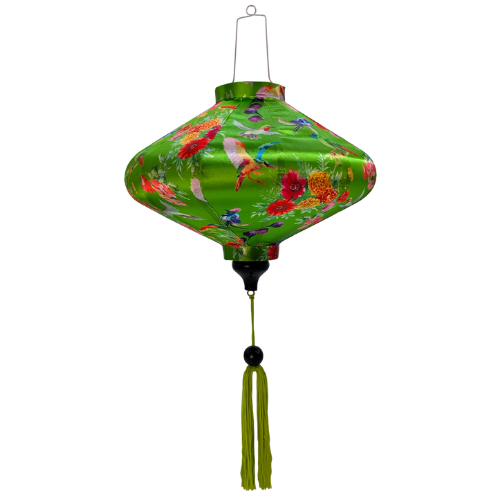 UFO shaped lantern with green tassel featuring a print of bright bunches of flowers and various feathery avian species on a bright green backdrop.