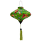 UFO shaped lantern with green tassel featuring a print of bright bunches of flowers and various feathery avian species on a bright green backdrop.