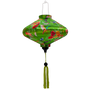 UFO shaped lantern with green tassel featuring a print of bright bunches of flowers and various feathery avian species on a bright green backdrop.