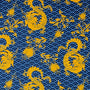 Polyester silk fabric used to create Vietnamese silk lantern featuring a pattern of golden yellow dragons and flowers on a dark blue background with blue sea swirls.