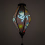 Glowing black silk lantern with blue dragons, symbols and red flames handmade in Hoi An.