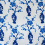 Pattern of blue vases and floral branches on a white background