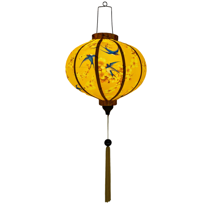 Glowing Traditional Vietnamese Round lantern with a smooth silk finish, ideal for indoor and outdoor decoration featuring blue swallows flying around with yellow flowers in their beaks on a yellow background.