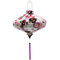 UFO shaped Vietnamese lantern with botanical floral pattern with pinks and purples on white background. 