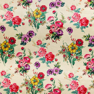 Polyester silk fabric with bunches of flowers in pink, purple, and yellow on a creamy butter background. Used to create Hoi An Lanterns.