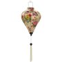 Balloon shaped Hoi An Lantern with white tassel featuring bunches of flowers in pink, purple, and yellow on a creamy butter background. 