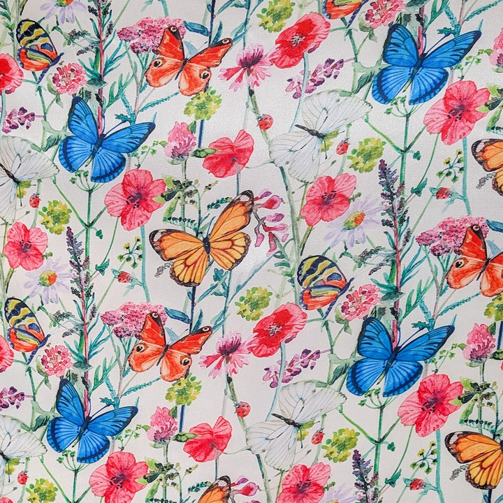 Pattern of colourful butterflies and wildflowers on a white background