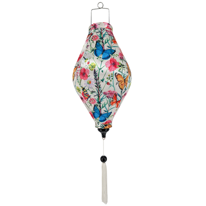 Hanging lantern with white tassel, floral and butterfly design on a white background