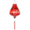 Garlic shaped lantern with red tassel and delicate pink cherry blossoms on red.