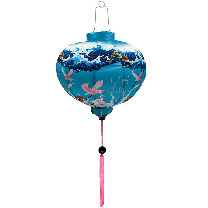 Round Vietnamese silk lantern perfect for a childs' room, featuring a redheaded young boys flying through the clouds, lifted by pink cranes balancing on flying fish surrounded by an ocean. 