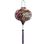 Round lantern with purple tassel.