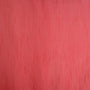A close-up of a textured coral pink polyester linen fabric.