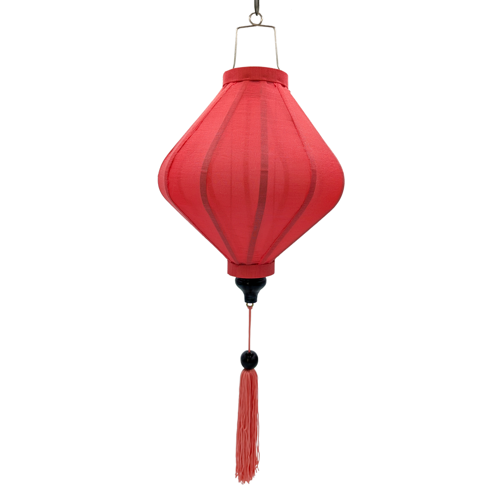 A coral pink poly linen fabric lantern with a hanging metal loop and a matching pink tassel.