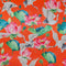 Polyester silk fabric with red-headed cranes and pink lotus flowers with large green leaves on bright orange silk used to created Vietnamese Lanterns in Hoi An.