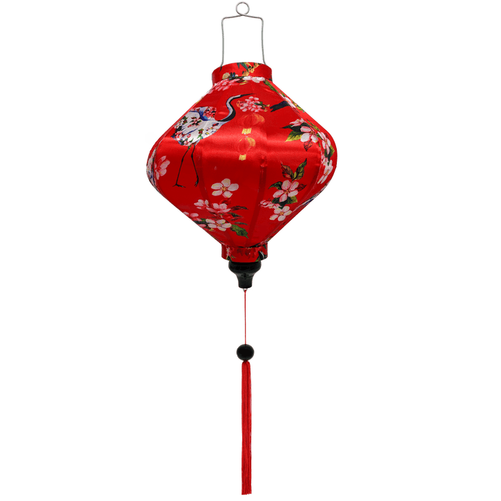 Lozenge shaped Vietnamese lantern with red tassel featuring  large Asian red-necked birds and round lanterns, surrounded by pink and white flowers on a red background.