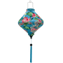 Lozenge shaped Vietnamese lantern with blue tassel and print of cranes and lotus flowers.