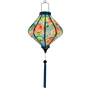 Glowing Lozenge shaped lantern with cranes and lotus flowers on blue.