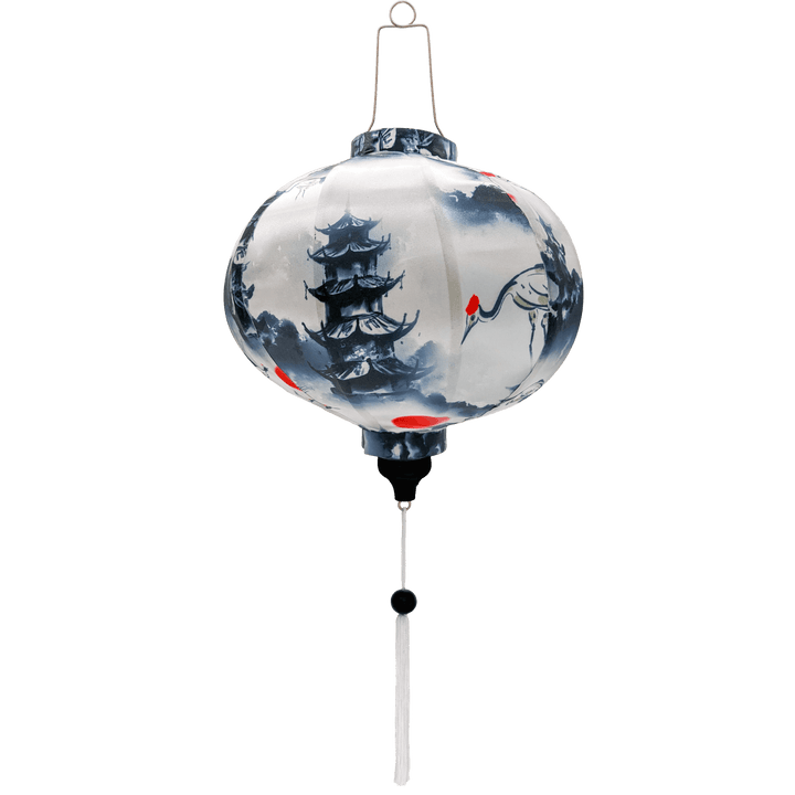 Round shaped lantern with red-crowned cranes and pagoda on white background.