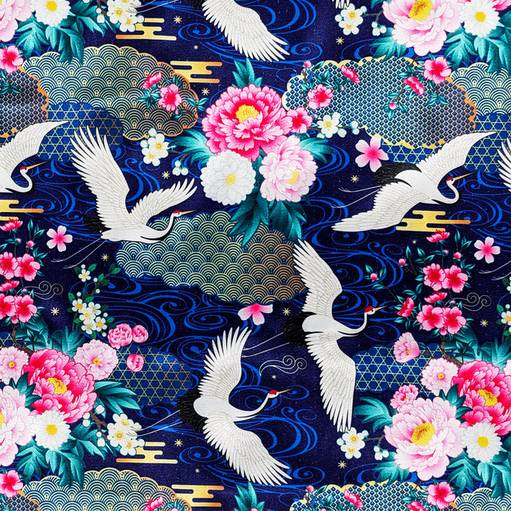 Beautiful polyester silk fabric with a print of white cranes flying amidst a dark blue background of geometric shapes, flowers, and golden clouds used to created Vietnamese Hoi An Lanterns.