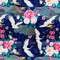 Beautiful polyester silk fabric with a print of white cranes flying amidst a dark blue background of geometric shapes, flowers, and golden clouds used to created Vietnamese Hoi An Lanterns.