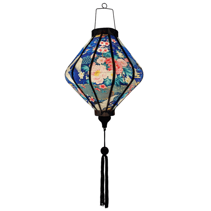 Glowing Lozenge shaped Vietnamese Hoi An lantern with blue tassel.