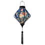 Glowing Lozenge shaped Vietnamese Hoi An lantern with blue tassel.