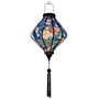 Glowing Lozenge shaped Vietnamese Hoi An lantern with blue tassel.
