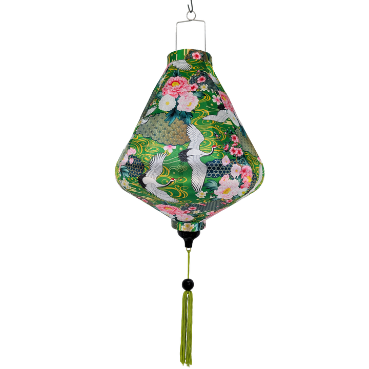 Teardrop shape lantern with floral and crane design on a green background