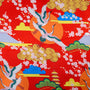 Traditional Japanese design with cranes, cherry blossoms, and Mount Fuji on a red background.
