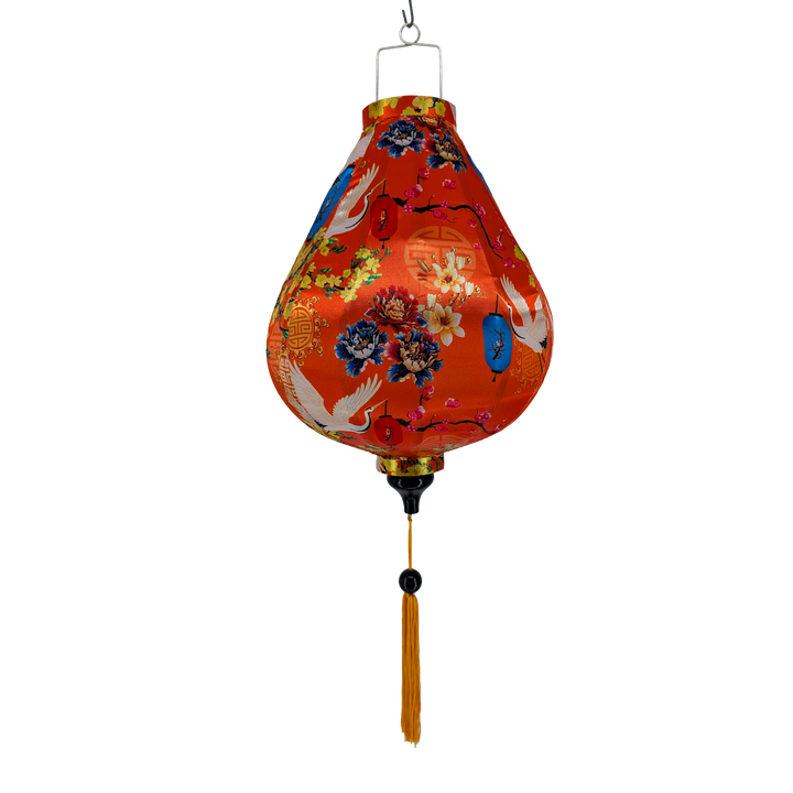 Garlic shaped silk lantern with floral patterns, motifs and cranes on a orange background