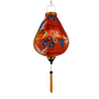 Garlic shaped silk lantern with floral patterns, motifs and cranes on a orange background