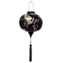 Round shaped Vietnamese Hoi An lantern featuring red-headed white cranes amongst pink cherry blossoms against a black background.