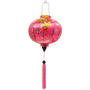 Round shaped Vietnamese lantern with pink tassels featuring a design of cranes, lanterns, firecrackers, and blooms of pink and yellow on a brilliant pink background. 
